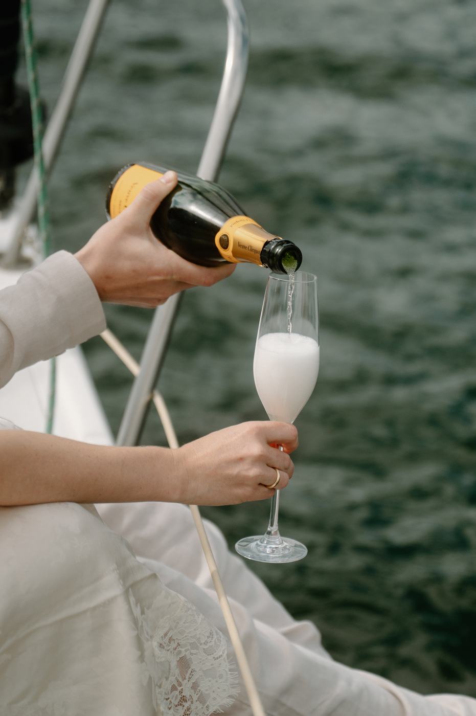 Champagne poured over the lake